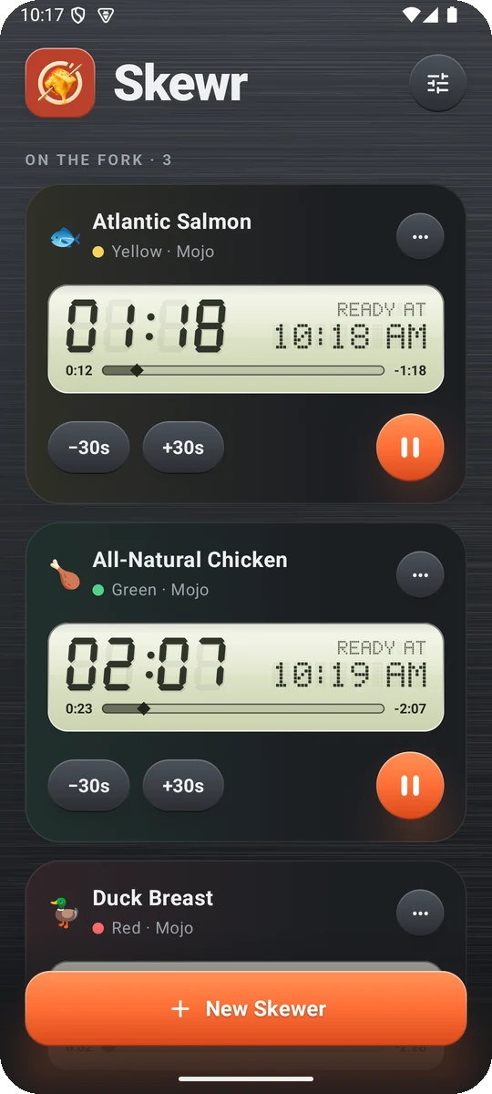 Skewr with three skewer timers running for salmon, chicken and duck